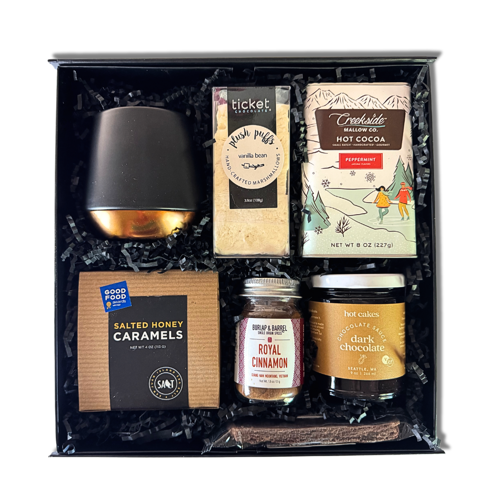 executive Christmas client cocoa gift box include a luxury double walled trendy mug, artisan marshmallows, chocolate sauce, drinking chocolate, royal cinnamon, caramels and northwest biscotti made in Washington.