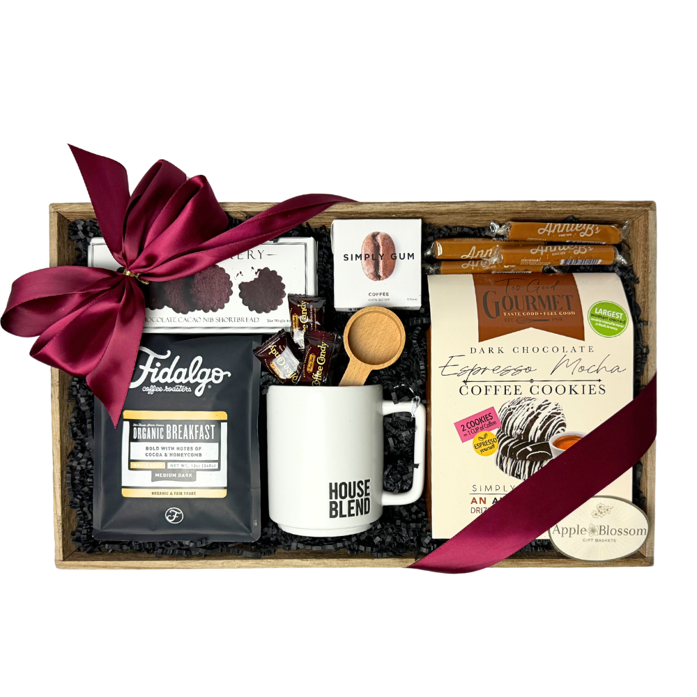 house blend gift basket includes a wooden tray, pound of organic coffee, mug, cookies, coffee scoop, coffee candy and coffee gum.  Apple Blossom Gift Baskets Made in Washington