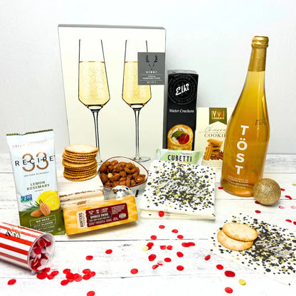 Lets Celebrate gift basket made in Washington comes with snacks drinks and crystal champagne flutes Apple Blossom Gift Baskets