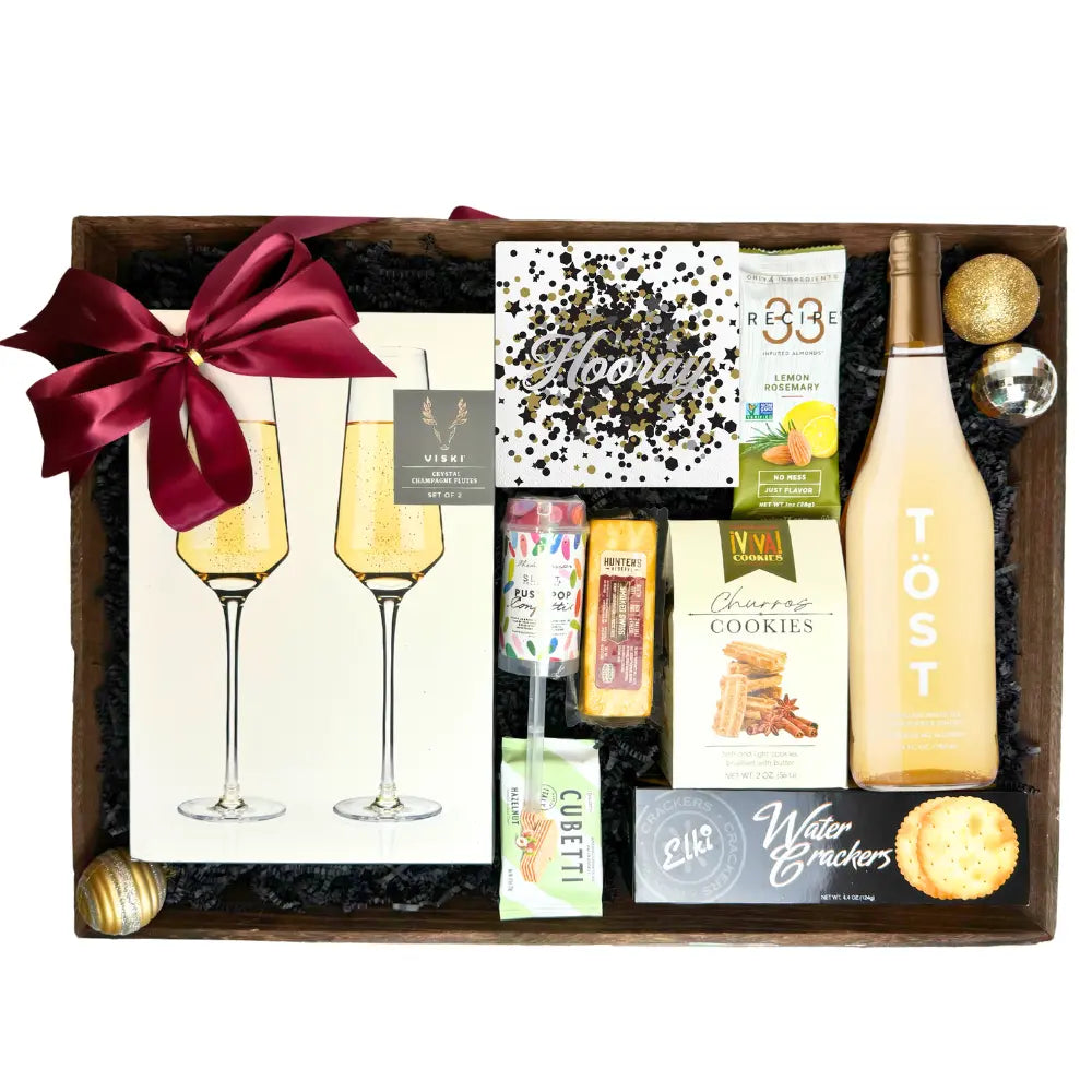 Lets Celebrate snack gift basket with non alcoholic drinks, cookies, cheese, crackers, party popper and champagne flutes  Apple Blossom Gift Baskets