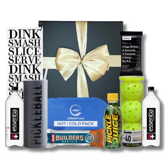 Pickleball Enthusiast gift box by Apple Blossom Gift Baskets includes pickleballs, sport water, protein bars, hot pack, pickleball tumbler, pickle juice and pickleball sport towel.  This gift box comes in a soft touch magnetic close box and is wrapped with a satin hand tied bow.