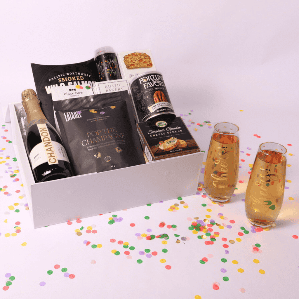 Raise a toast with our deluxe champagne and flute gift set! This elegant pairing of bubbly, artisanal snacks, and stylish glassware is perfect for engagements, New Year's, and milestone celebrations.