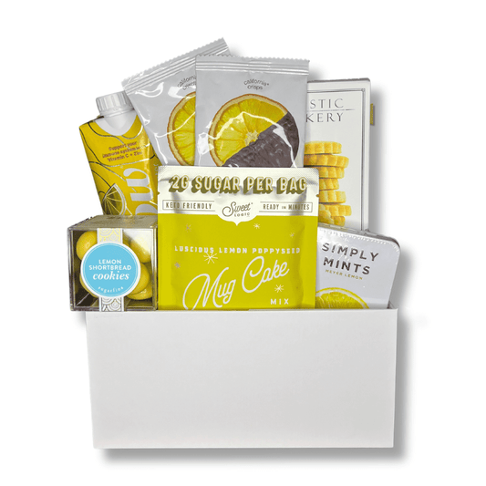 cheerful delights yellow treat gift box includes, lemon mug cake, lemon cookies, lemon water, mints, candy cube and dried lemon slices