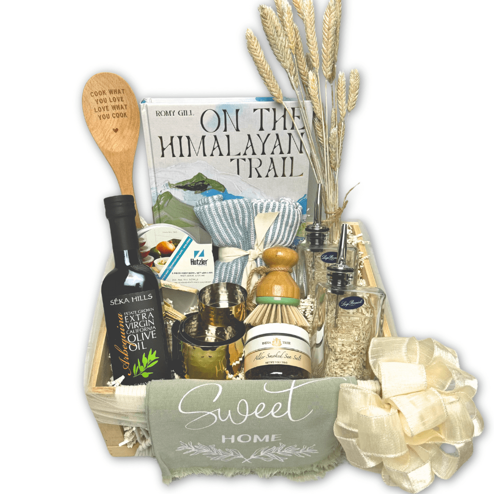 chef inspired gift basket with cookbook, measuring cups, olive oil, sea salt, kitchen towel and kitchen accessories