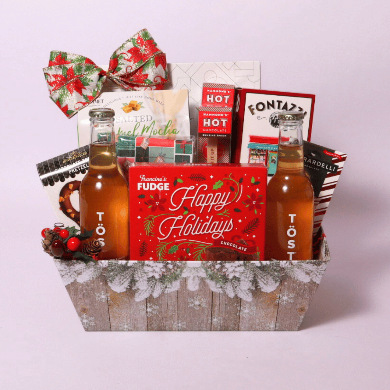 Christmas Snack Gift Basket filled with Belgian chocolate biscuits, hot cocoa sticks, and festive treats in a holiday-themed package.