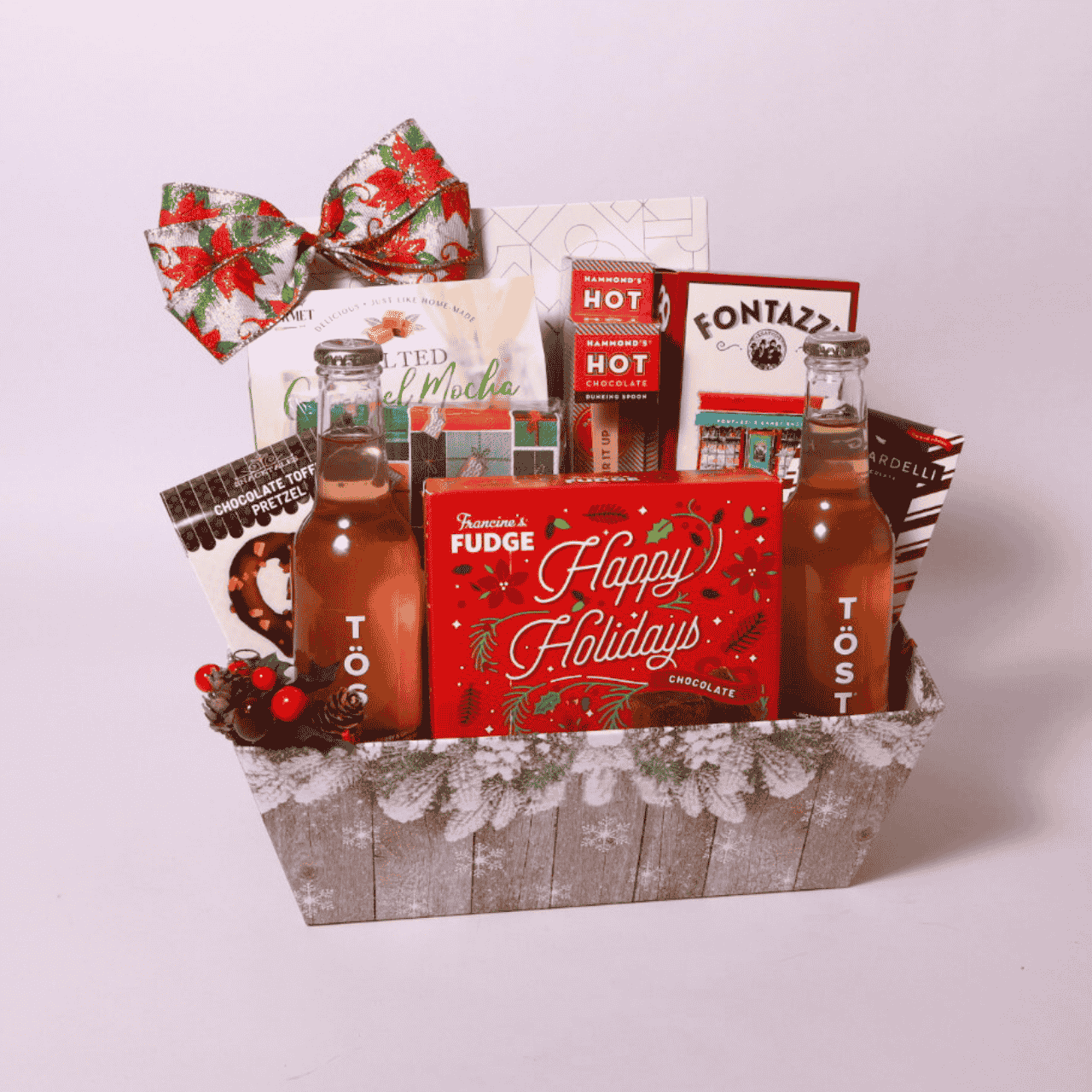 Holiday Gourmet Treats Basket featuring sparkling TÖST drinks, peppermint bark, and a variety of sweet and savory snacks.