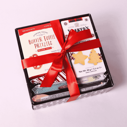 Elegant holiday gift tray of locally sourced snacks, ideal for corporate gifting with personalized messages and festive packaging.