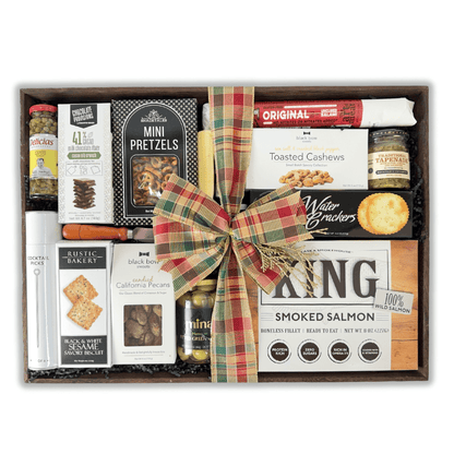 holiday charcuterie tray loaded with luxury snacks made in Washington and include: smoked salmon, crackers, cheese, capers, nuts, tapenade, pretzels, chocolate squares and more!