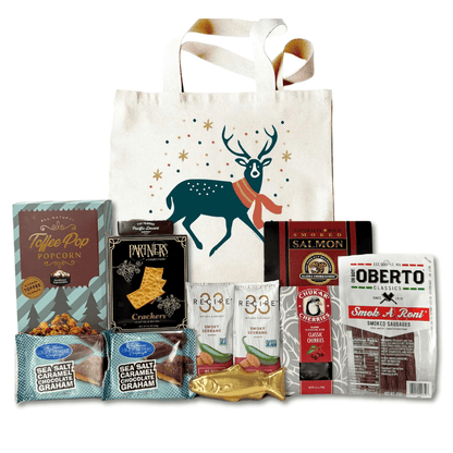 made in washington gift in holiday reindeer tote with local snacks caramel corn, pepperoni sticks, smoked salmon, solid chocolate salmon, smoked almonds, chocolates, crackers and more.