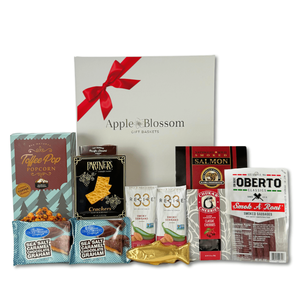 made in washington gift box with local snacks caramel corn, pepperoni sticks, smoked salmon, solid chocolate salmon, smoked almonds, chocolates, crackers and more.