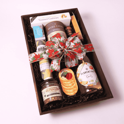 Elegant gift basket for food lovers featuring locally sourced Pacific Northwest treats including smoked cheese, Asiago wine chips, gourmet tapenade, and water crackers.