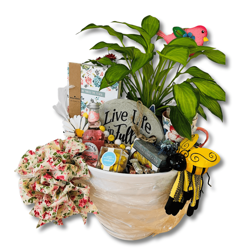 retirement gardener gift basket included a live plant, garden journal, gloves, decor, coasters, cookies and  lemonade wrapped with a floral bow in a planter