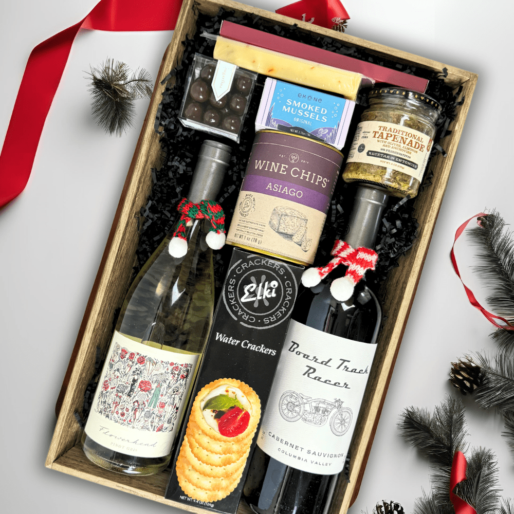 made in Washington wine and snack tray in a wooden tray the high end gift includes pinot gris, cabernet sauvignon, crackers, cheese, smoked muscles, wine chips, sea salt caramels, peppermint bark and other snacks