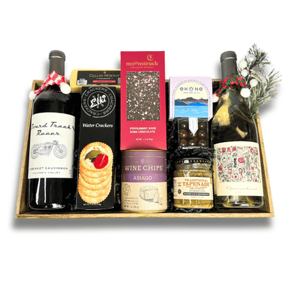 made in Washington wine and snack tray in a wooden tray the high end gift includes pinot gris, cabernet sauvignon, crackers, cheese, smoked muscles, wine chips, sea salt caramels, peppermint bark and other snacks